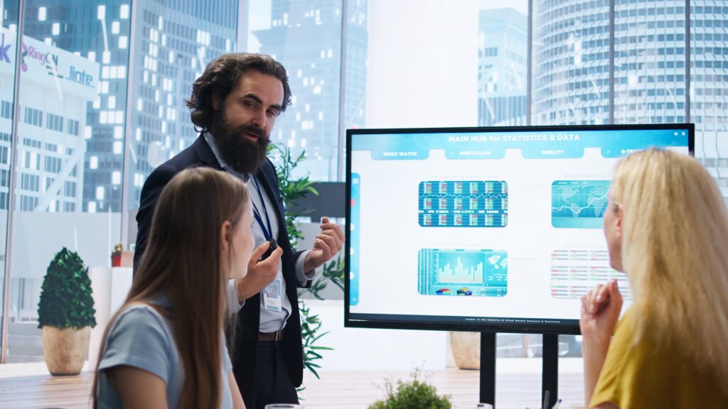 financial advisor presents detailed stock market analysis to clients financial advisor presents detailed stock market analysis to clients